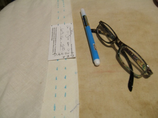 casing marked for stitching, with marking card, marker, and 
                     magnifying glasses