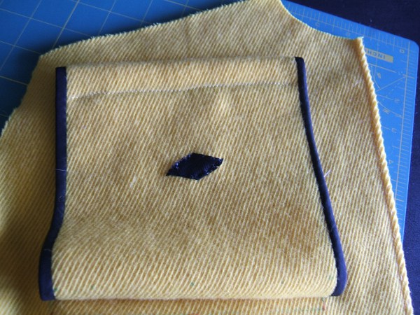 ribbon sewn to pocket