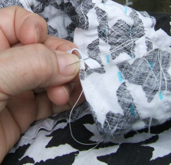 taking third and final stitch, not in focus