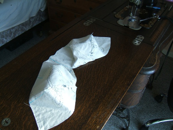 Four of the darts in the crown have been 
                     sewn